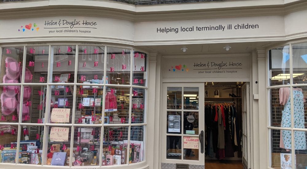 Abingdon shop window with pink items and banners_1000x550 Abingdon shop window with pink items and banners