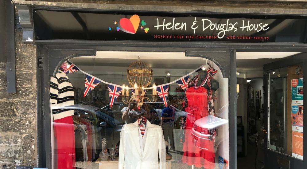 Burford shop window with bunting and Helen & Douglas logo_1000x550 Burford shop window with bunting and Helen & Douglas logo