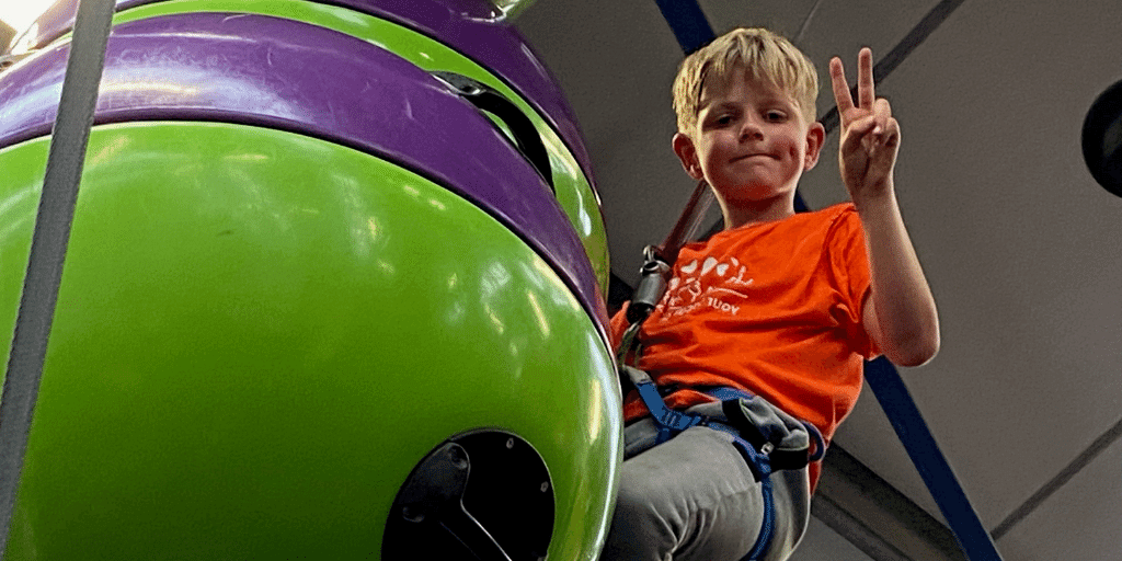 ethan climbing with orange HDH tshirt_1000x500