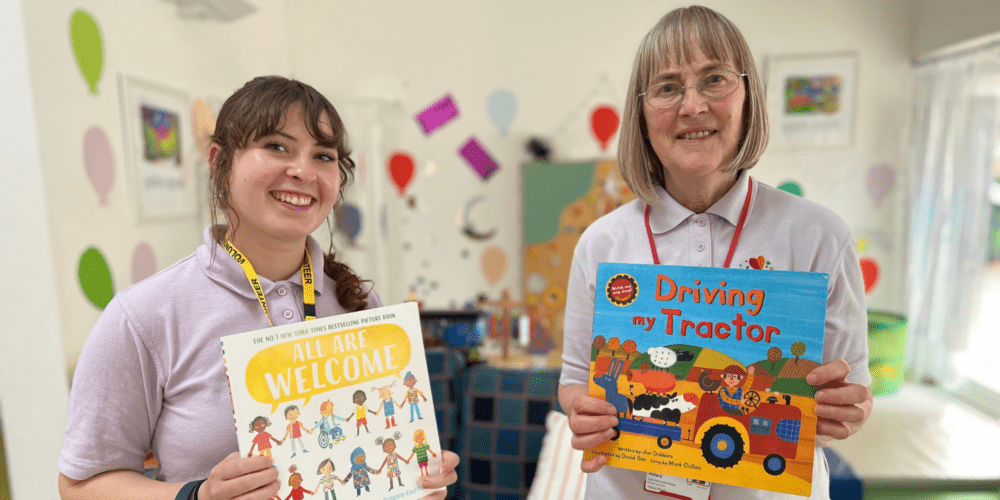 NEW website - Headers in Divi 2,000 pixels (1) Woman and girl holding childrens books at the hospice